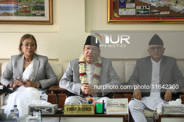 Nepal's newly appointed Chief Justice Prakashman Singh Raut (center) addresses the media alongside senior justices of the Supreme Court afte...