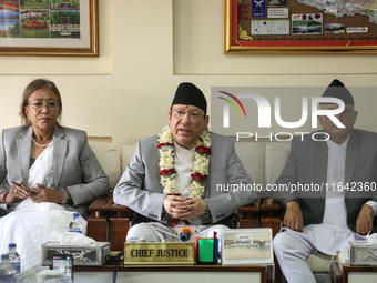 Nepal's newly appointed Chief Justice Prakashman Singh Raut (center) addresses the media alongside senior justices of the Supreme Court afte...