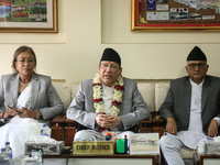 Nepal's newly appointed Chief Justice Prakashman Singh Raut (center) addresses the media alongside senior justices of the Supreme Court afte...