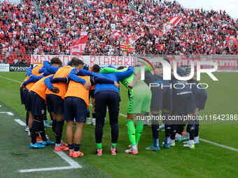 The Brescia Calcio FC team stands before the Italian Serie B soccer championship match between Mantova Calcio 1911 and Brescia Calcio FC at...