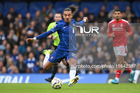 Malo Gusto of Chelsea lines up a shot at goal during the Premier League match between Chelsea and Nottingham Forest at Stamford Bridge in Lo...