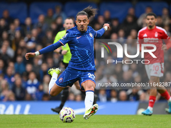 Malo Gusto of Chelsea lines up a shot at goal during the Premier League match between Chelsea and Nottingham Forest at Stamford Bridge in Lo...