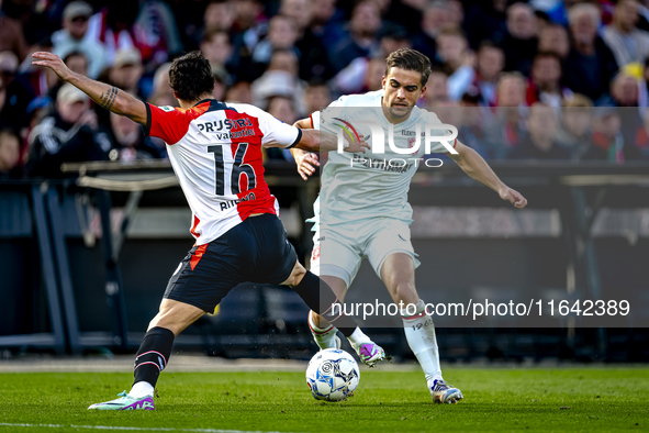 FC Twente defender Bart van Rooij and Feyenoord Rotterdam defender Hugo Bueno play during the match between Feyenoord and Twente at the Feye...