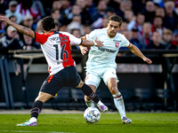 FC Twente defender Bart van Rooij and Feyenoord Rotterdam defender Hugo Bueno play during the match between Feyenoord and Twente at the Feye...