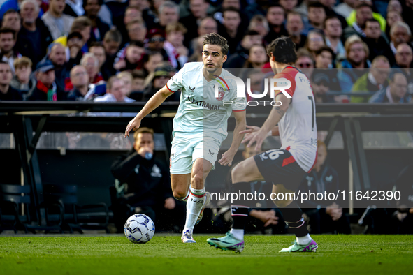 FC Twente defender Bart van Rooij and Feyenoord Rotterdam defender Hugo Bueno play during the match between Feyenoord and Twente at the Feye...