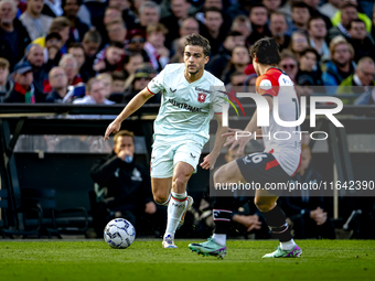 FC Twente defender Bart van Rooij and Feyenoord Rotterdam defender Hugo Bueno play during the match between Feyenoord and Twente at the Feye...