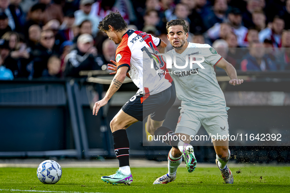 FC Twente defender Bart van Rooij and Feyenoord Rotterdam defender Hugo Bueno play during the match between Feyenoord and Twente at the Feye...