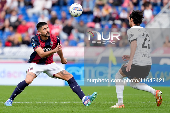 Martin Erlic of Bologna FC and Matteo Cancellieri of Parma Calcio 1903 compete for the ball during the Serie A Enilive match between Bologna...