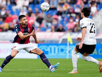 Martin Erlic of Bologna FC and Matteo Cancellieri of Parma Calcio 1903 compete for the ball during the Serie A Enilive match between Bologna...