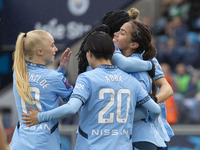 Mary Fowler #8 of Manchester City W.F.C. celebrates her goal with teammates during the Barclays FA Women's Super League match between Manche...