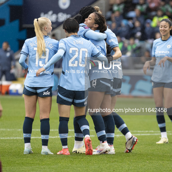 Mary Fowler #8 of Manchester City W.F.C. celebrates her goal with teammates during the Barclays FA Women's Super League match between Manche...