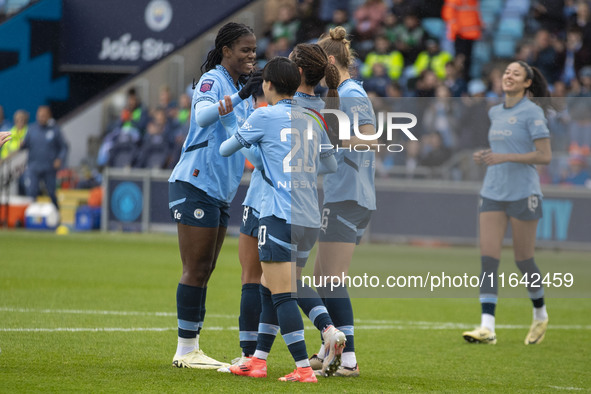 Mary Fowler #8 of Manchester City W.F.C. celebrates her goal with teammates during the Barclays FA Women's Super League match between Manche...