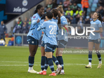 Mary Fowler #8 of Manchester City W.F.C. celebrates her goal with teammates during the Barclays FA Women's Super League match between Manche...