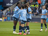 Mary Fowler #8 of Manchester City W.F.C. celebrates her goal with teammates during the Barclays FA Women's Super League match between Manche...