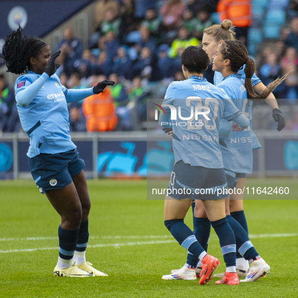 Mary Fowler #8 of Manchester City W.F.C. celebrates her goal with teammates during the Barclays FA Women's Super League match between Manche...