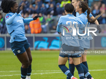 Mary Fowler #8 of Manchester City W.F.C. celebrates her goal with teammates during the Barclays FA Women's Super League match between Manche...