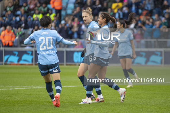 Mary Fowler #8 of Manchester City W.F.C. celebrates her goal with teammates during the Barclays FA Women's Super League match between Manche...