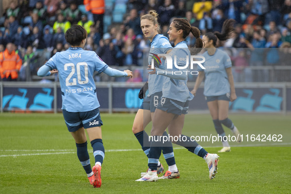 Mary Fowler #8 of Manchester City W.F.C. celebrates her goal with teammates during the Barclays FA Women's Super League match between Manche...