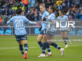 Mary Fowler #8 of Manchester City W.F.C. celebrates her goal with teammates during the Barclays FA Women's Super League match between Manche...