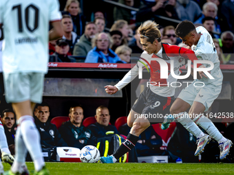 Feyenoord Rotterdam forward Ayase Ueda and FC Twente defender Mees Hilgers play during the match between Feyenoord and Twente at the Feyenoo...