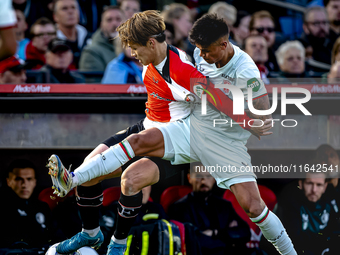 Feyenoord Rotterdam forward Ayase Ueda and FC Twente defender Mees Hilgers play during the match between Feyenoord and Twente at the Feyenoo...