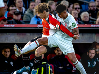 Feyenoord Rotterdam forward Ayase Ueda and FC Twente defender Mees Hilgers play during the match between Feyenoord and Twente at the Feyenoo...