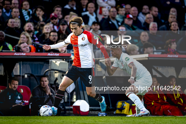 Feyenoord Rotterdam forward Ayase Ueda and FC Twente defender Mees Hilgers play during the match between Feyenoord and Twente at the Feyenoo...