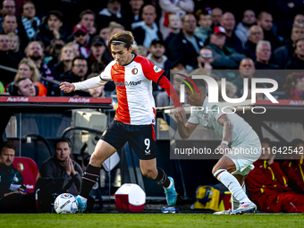 Feyenoord Rotterdam forward Ayase Ueda and FC Twente defender Mees Hilgers play during the match between Feyenoord and Twente at the Feyenoo...