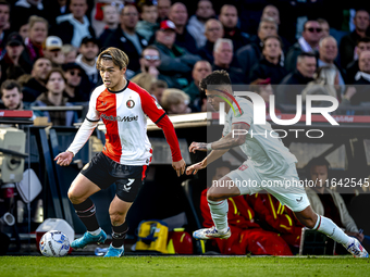 Feyenoord Rotterdam forward Ayase Ueda and FC Twente defender Mees Hilgers play during the match between Feyenoord and Twente at the Feyenoo...