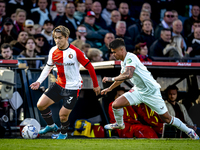 Feyenoord Rotterdam forward Ayase Ueda and FC Twente defender Mees Hilgers play during the match between Feyenoord and Twente at the Feyenoo...