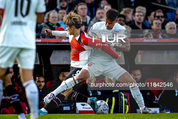 Feyenoord Rotterdam forward Ayase Ueda and FC Twente defender Mees Hilgers play during the match between Feyenoord and Twente at the Feyenoo...