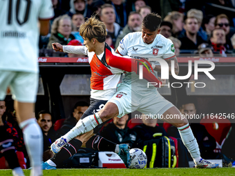 Feyenoord Rotterdam forward Ayase Ueda and FC Twente defender Mees Hilgers play during the match between Feyenoord and Twente at the Feyenoo...