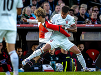 Feyenoord Rotterdam forward Ayase Ueda and FC Twente defender Mees Hilgers play during the match between Feyenoord and Twente at the Feyenoo...