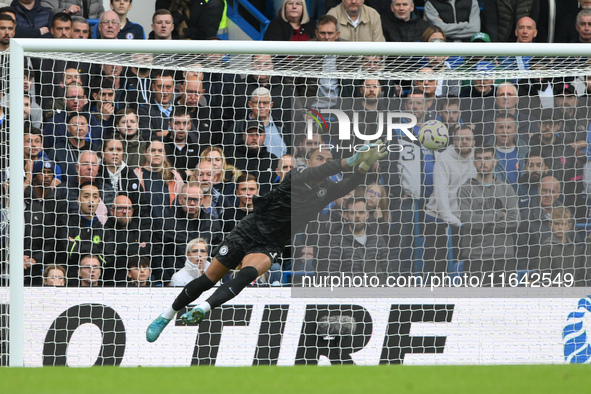 Robert Sanchez, Chelsea goalkeeper, makes a diving save during the Premier League match between Chelsea and Nottingham Forest at Stamford Br...