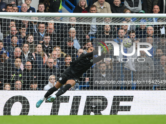 Robert Sanchez, Chelsea goalkeeper, makes a diving save during the Premier League match between Chelsea and Nottingham Forest at Stamford Br...