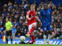 James Ward-Prowse of Nottingham Forest passes the ball during the Premier League match between Chelsea and Nottingham Forest at Stamford Bri...