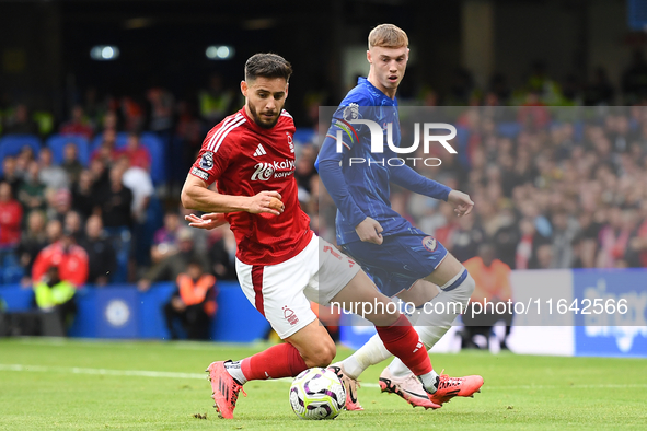 Alex Moreno of Nottingham Forest controls the ball under pressure from Cole Palmer of Chelsea during the Premier League match between Chelse...