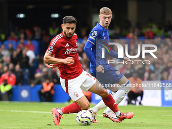 Alex Moreno of Nottingham Forest controls the ball under pressure from Cole Palmer of Chelsea during the Premier League match between Chelse...