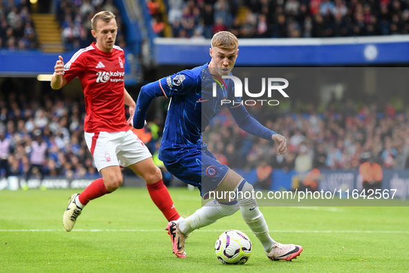 Cole Palmer of Chelsea is under pressure from James Ward-Prowse of Nottingham Forest during the Premier League match between Chelsea and Not...