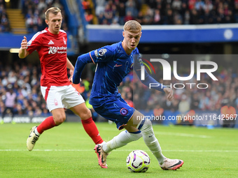 Cole Palmer of Chelsea is under pressure from James Ward-Prowse of Nottingham Forest during the Premier League match between Chelsea and Not...