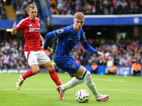 Cole Palmer of Chelsea is under pressure from James Ward-Prowse of Nottingham Forest during the Premier League match between Chelsea and Not...