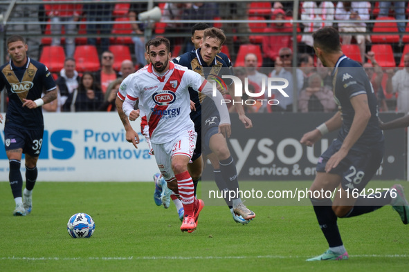 Simone Trimboli of Mantova 1911 follows Giacomo Olzer of Brescia Calcio FC during the Italian Serie B soccer championship football match bet...