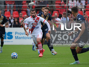 Simone Trimboli of Mantova 1911 follows Giacomo Olzer of Brescia Calcio FC during the Italian Serie B soccer championship football match bet...