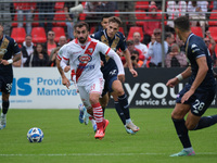 Simone Trimboli of Mantova 1911 follows Giacomo Olzer of Brescia Calcio FC during the Italian Serie B soccer championship football match bet...