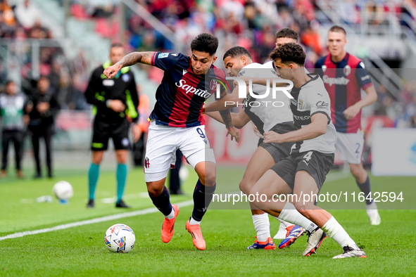 Santiago Castro of Bologna FC and Botond Balogh of Parma Calcio 1903 compete for the ball during the Serie A Enilive match between Bologna F...