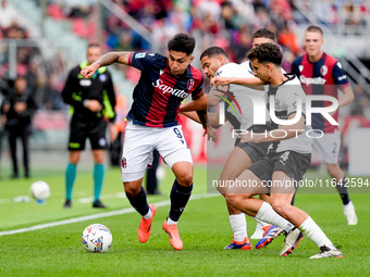 Santiago Castro of Bologna FC and Botond Balogh of Parma Calcio 1903 compete for the ball during the Serie A Enilive match between Bologna F...