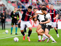 Santiago Castro of Bologna FC and Botond Balogh of Parma Calcio 1903 compete for the ball during the Serie A Enilive match between Bologna F...