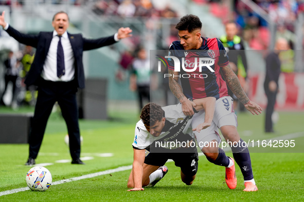 Santiago Castro of Bologna FC and Botond Balogh of Parma Calcio 1903 compete for the ball during the Serie A Enilive match between Bologna F...