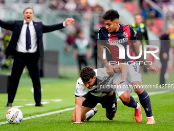 Santiago Castro of Bologna FC and Botond Balogh of Parma Calcio 1903 compete for the ball during the Serie A Enilive match between Bologna F...