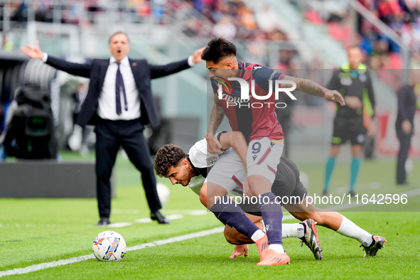 Santiago Castro of Bologna FC and Botond Balogh of Parma Calcio 1903 compete for the ball during the Serie A Enilive match between Bologna F...